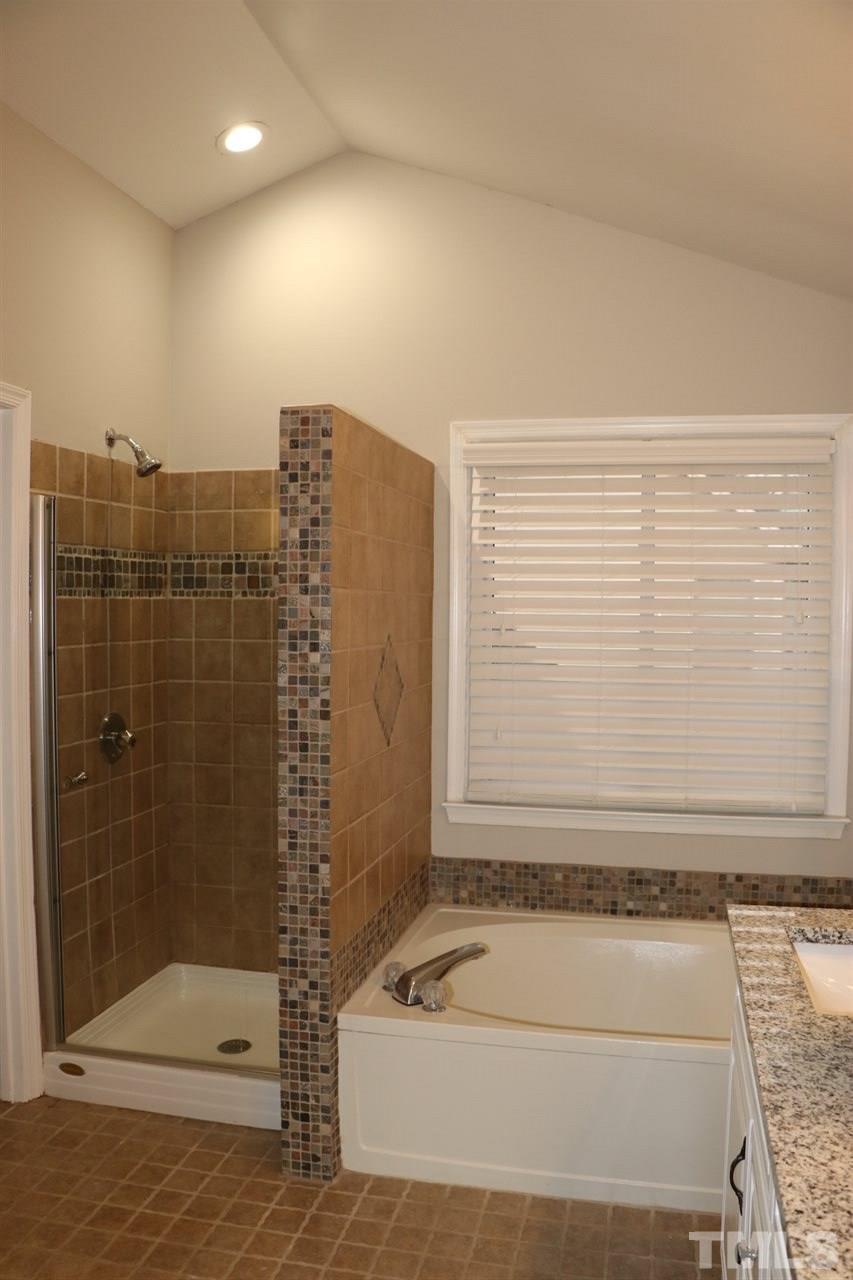 5713 Edgebury Road Raleigh, NC 27613 - Photo 18 of 26 a bathroom with a shower