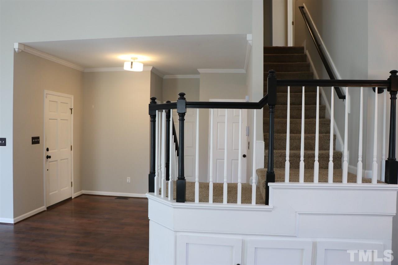 5713 Edgebury Road Raleigh, NC 27613 - Photo 3 of 26 a view of an entryway with wooden floor