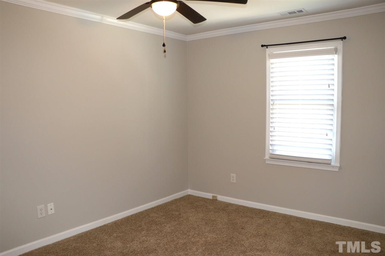 5713 Edgebury Road Raleigh, NC 27613 - Photo 22 of 26 an empty room with a window