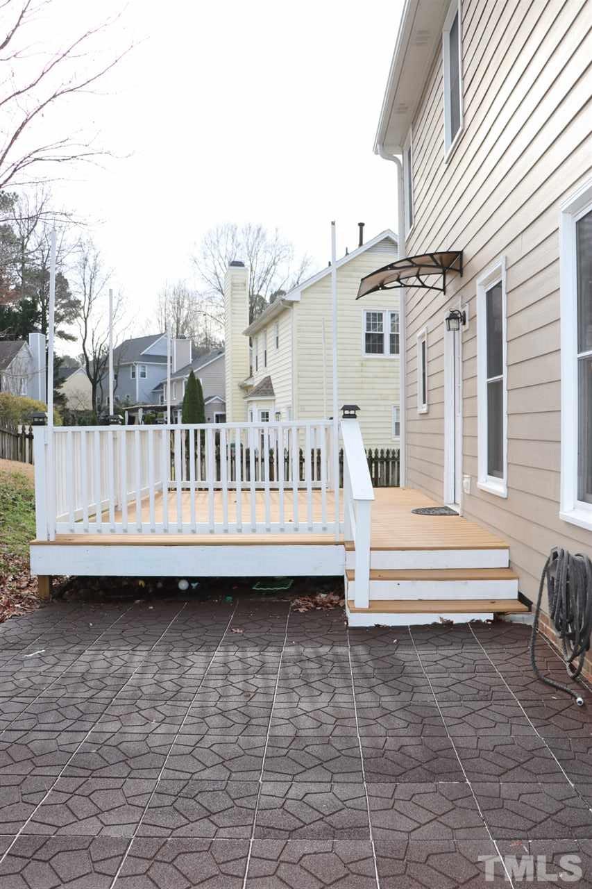 5713 Edgebury Road Raleigh, NC 27613 - Photo 24 of 26 a view of a house with a wooden deck