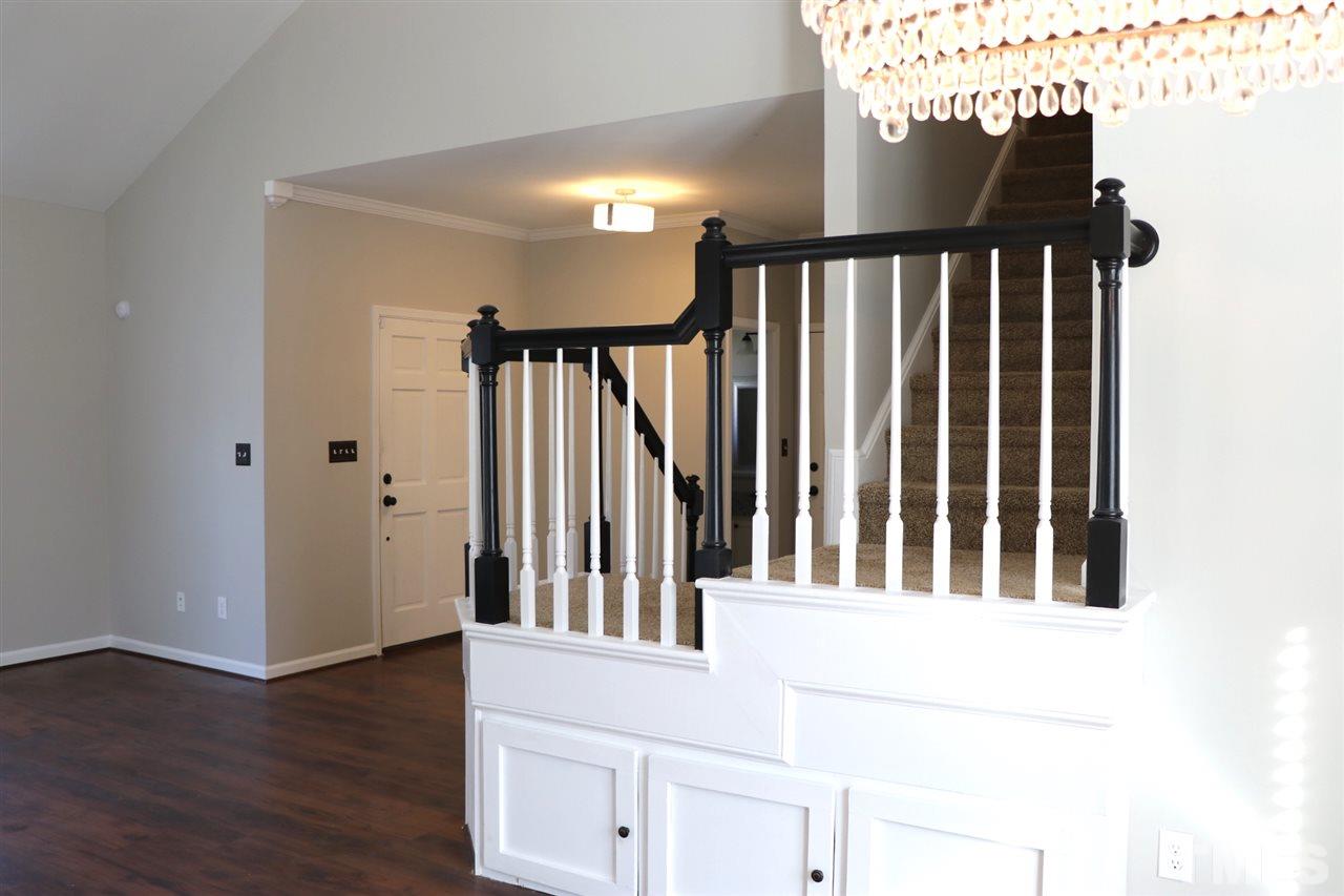 5713 Edgebury Road Raleigh, NC 27613 - Photo 5 of 26 a view of staircase with railing and a rug