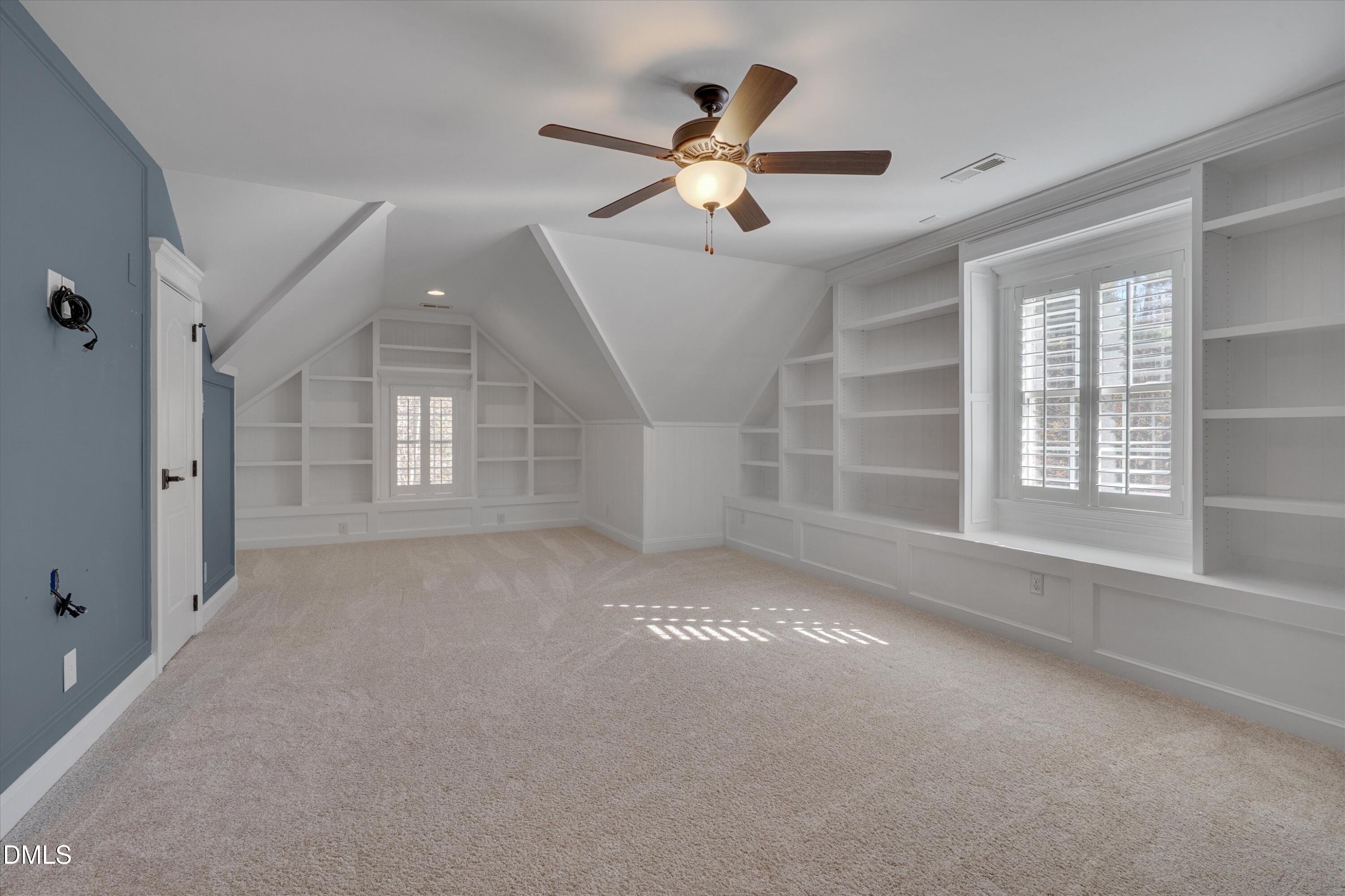 7013 Potomac Court Raleigh, NC 27613 - Photo 61 of 78 Third floor Rec Room with custom shelving