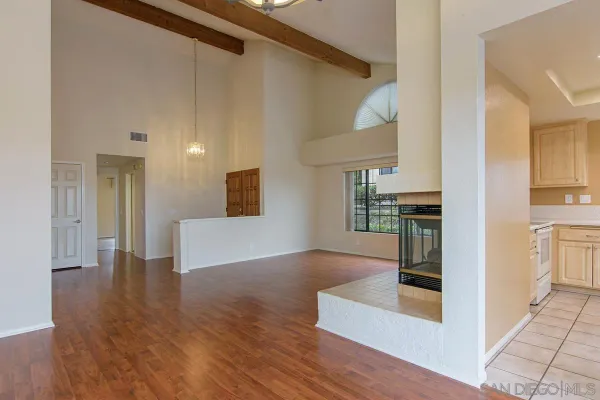 a view of a kitchen cabinets and wooden floor