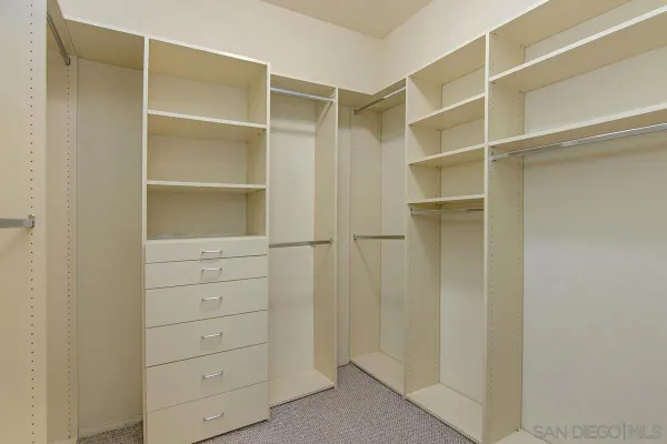 a view of an empty walk in closet