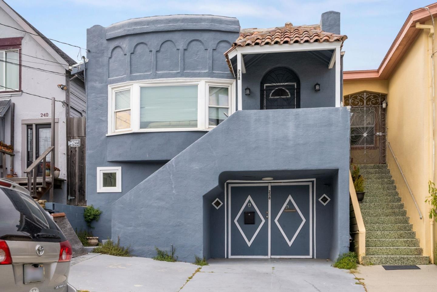 a front view of a house with garage