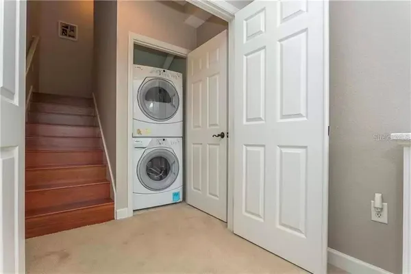 a view of entryway with wooden floor and a window
