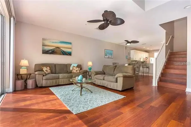 a living room with furniture and a rug