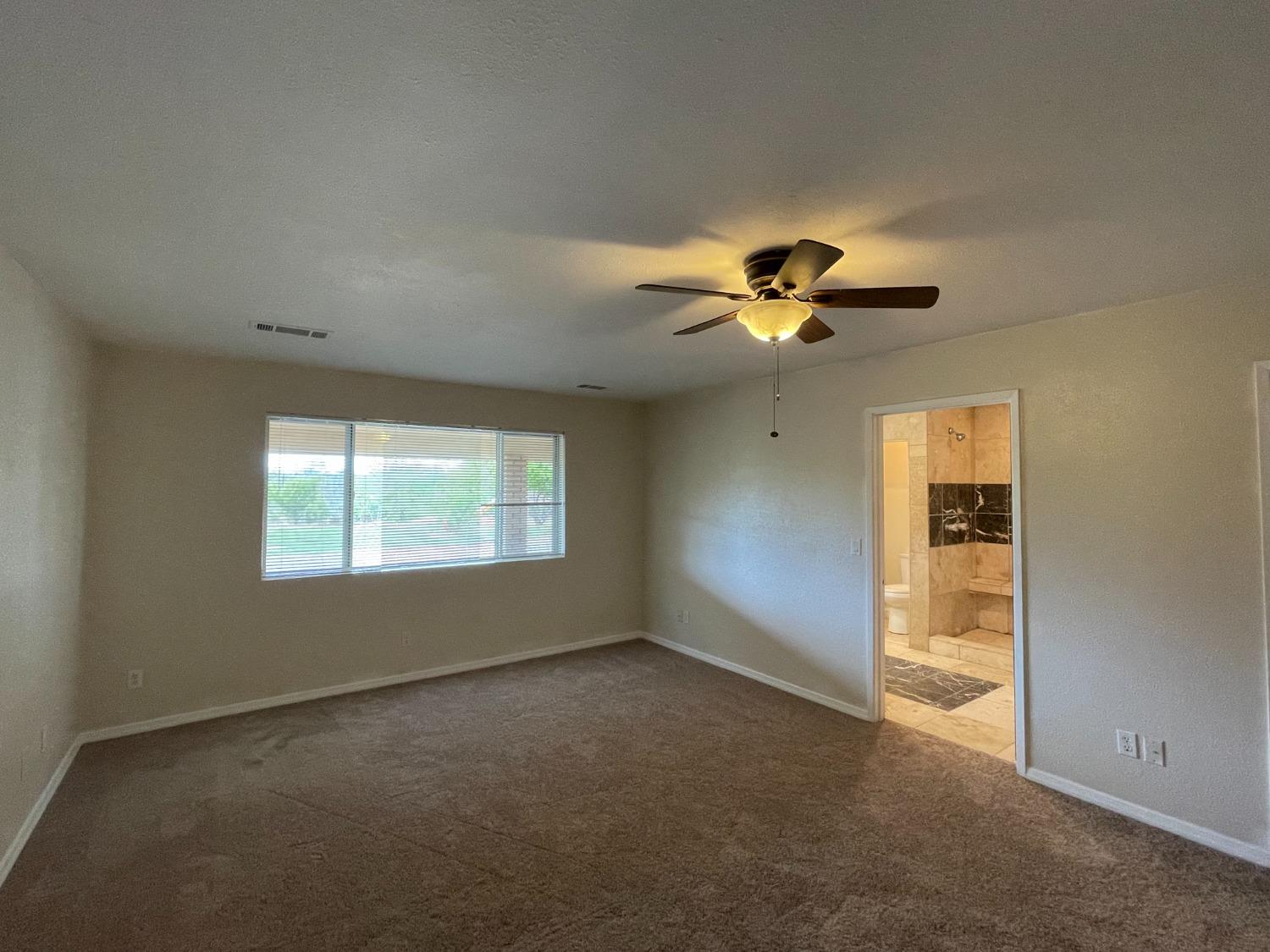 2344 Tivy Valley Road Sanger, CA 93657 - Photo 14 of 61 a view of an empty room with a window