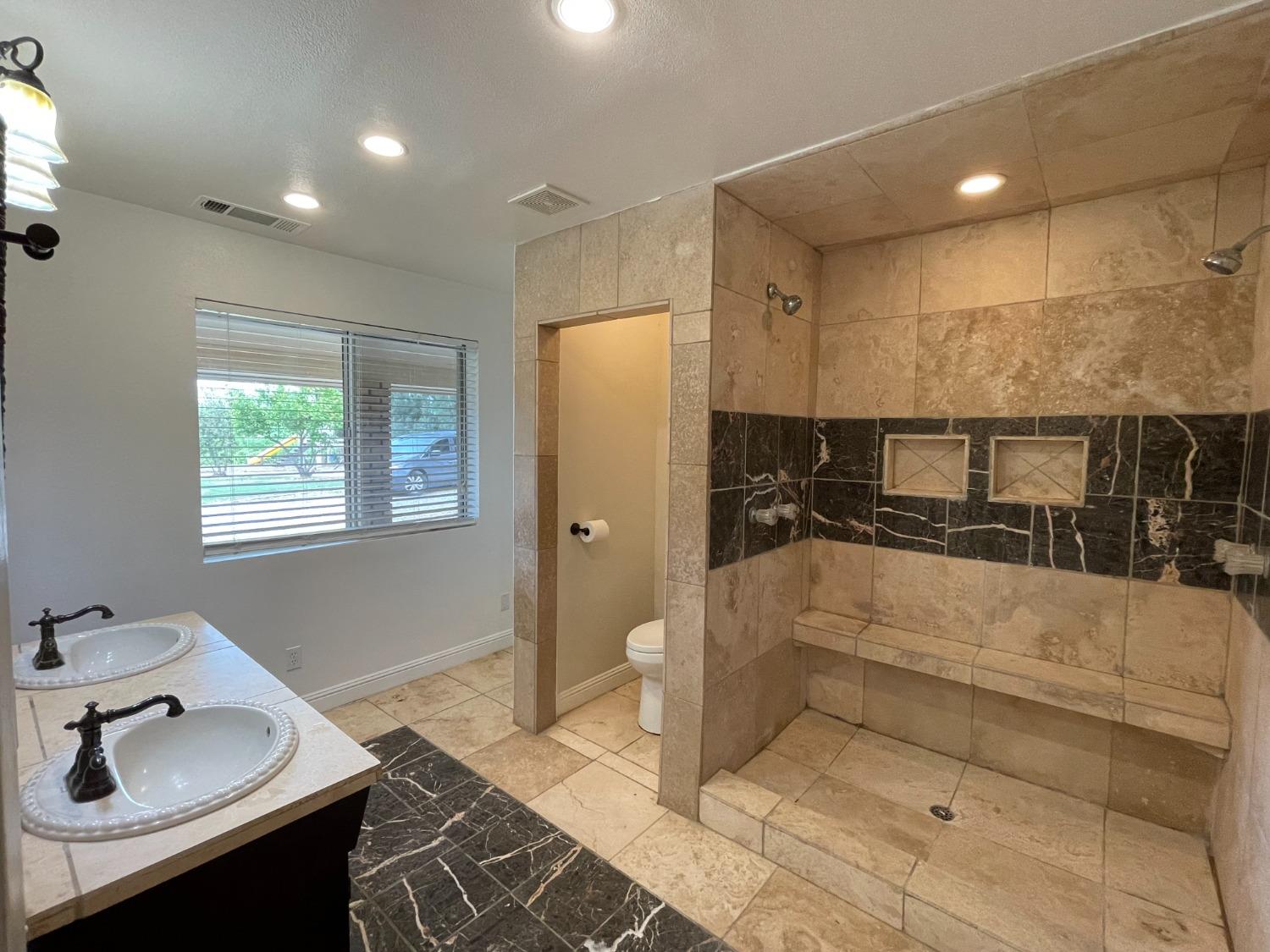 2344 Tivy Valley Road Sanger, CA 93657 - Photo 17 of 61 a bathroom with a sink and a mirror
