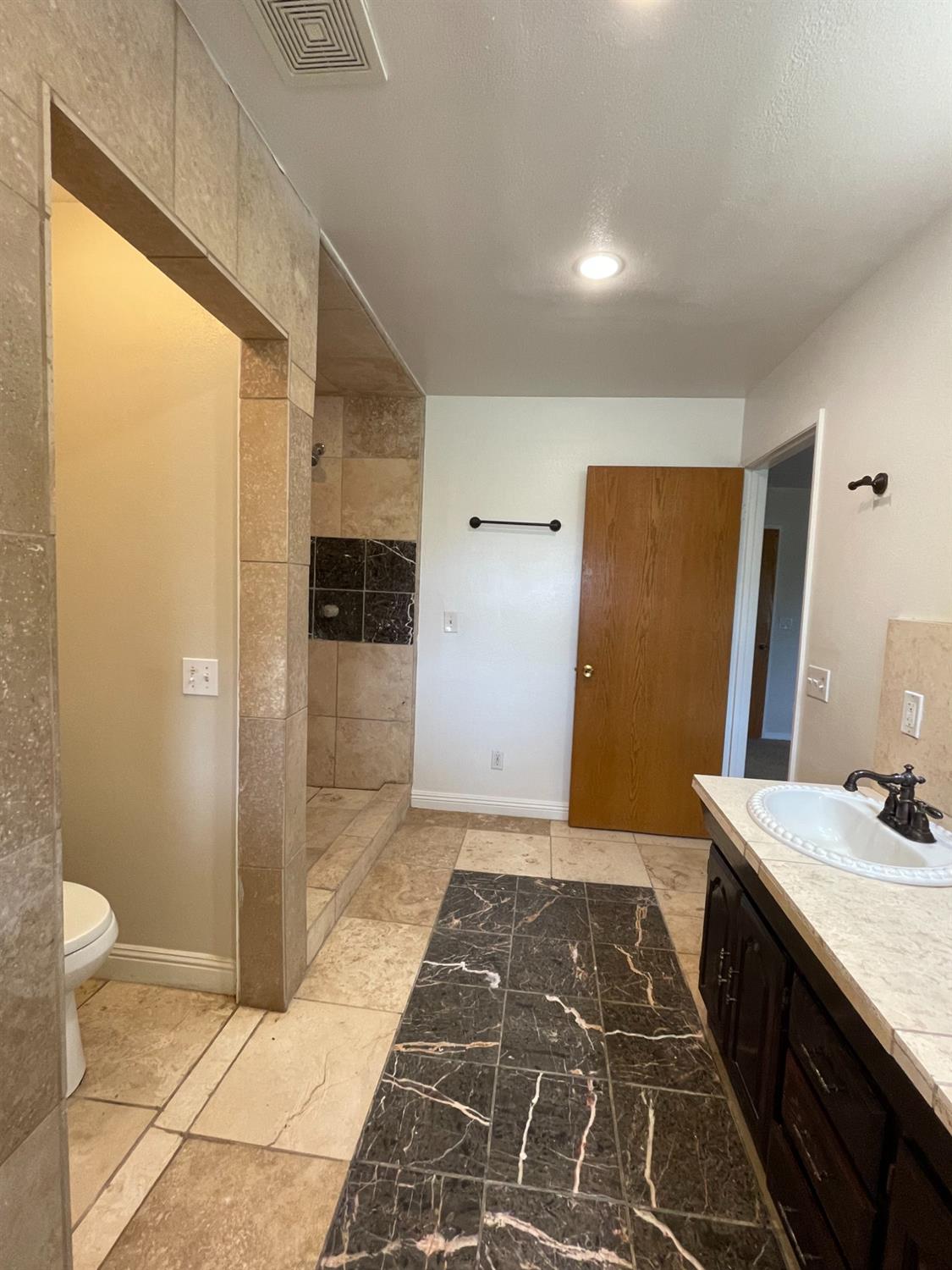2344 Tivy Valley Road Sanger, CA 93657 - Photo 18 of 61 a bathroom with a sink and a mirror