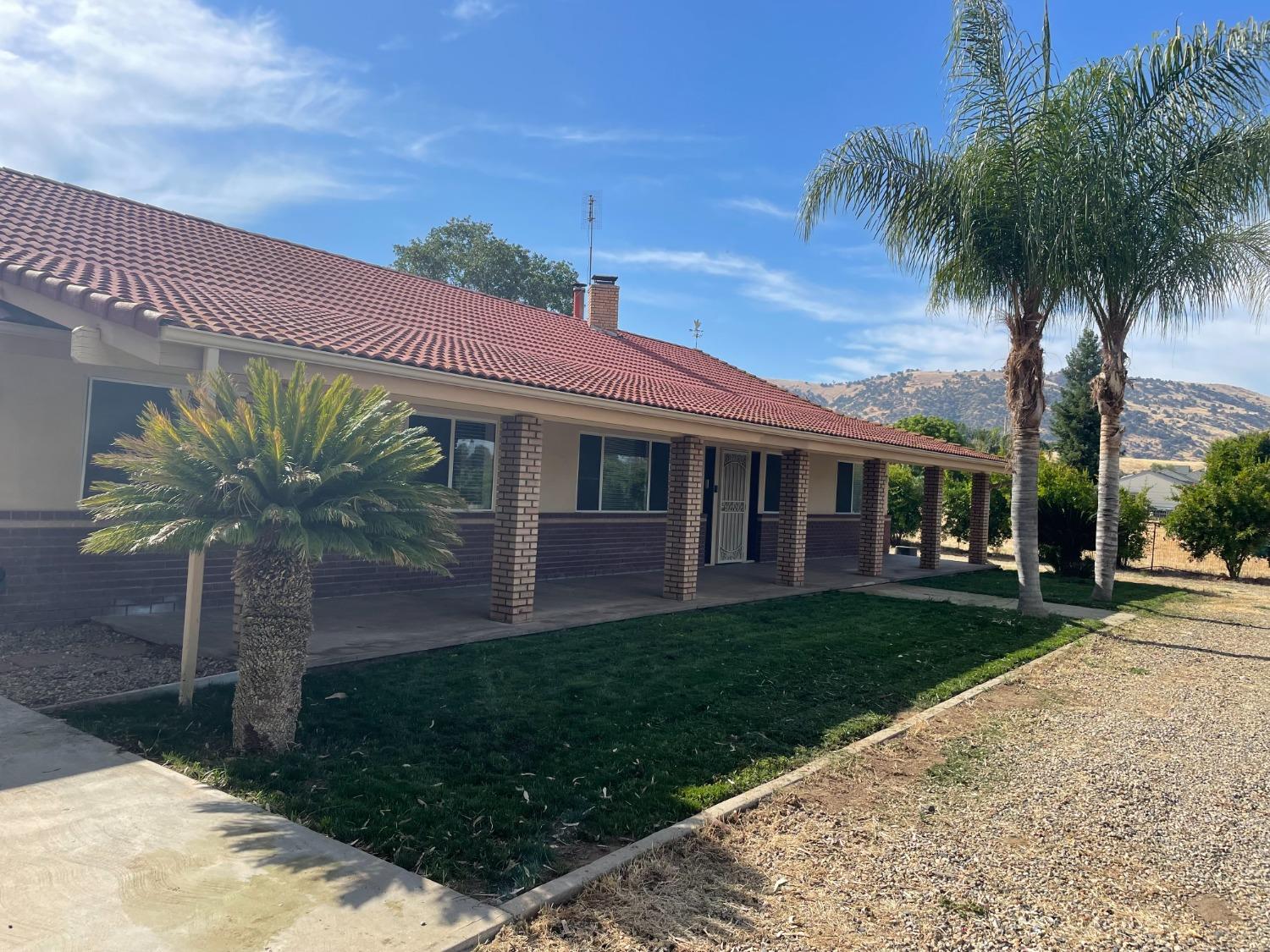 2344 Tivy Valley Road Sanger, CA 93657 - Photo 2 of 61 a front view of a house with a garden