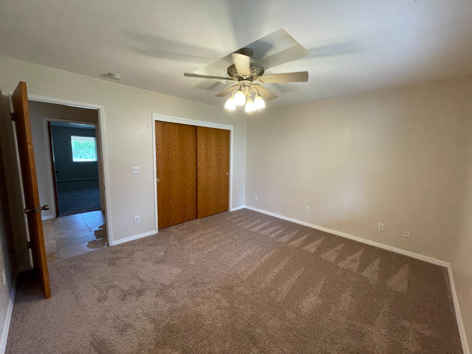 2344 Tivy Valley Road Sanger, CA 93657 - Photo 25 of 61 a view of a livingroom with a ceiling fan and a ceiling fan