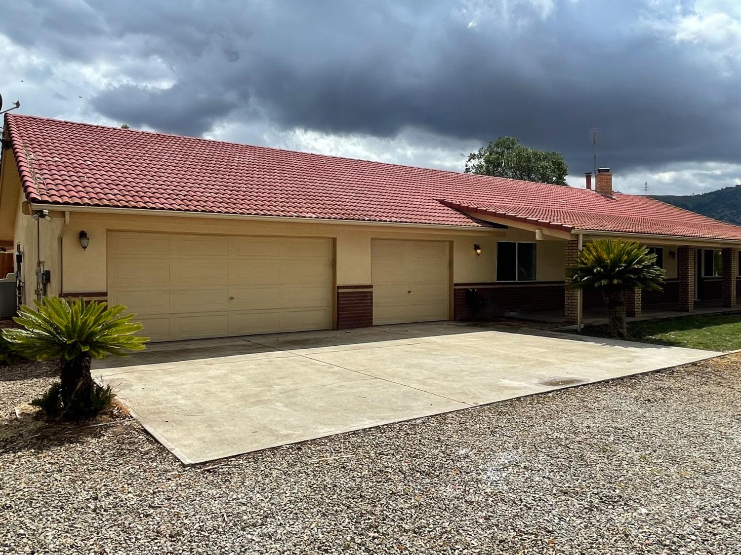 2344 Tivy Valley Road Sanger, CA 93657 - Photo 3 of 61 a front view of a house with a yard