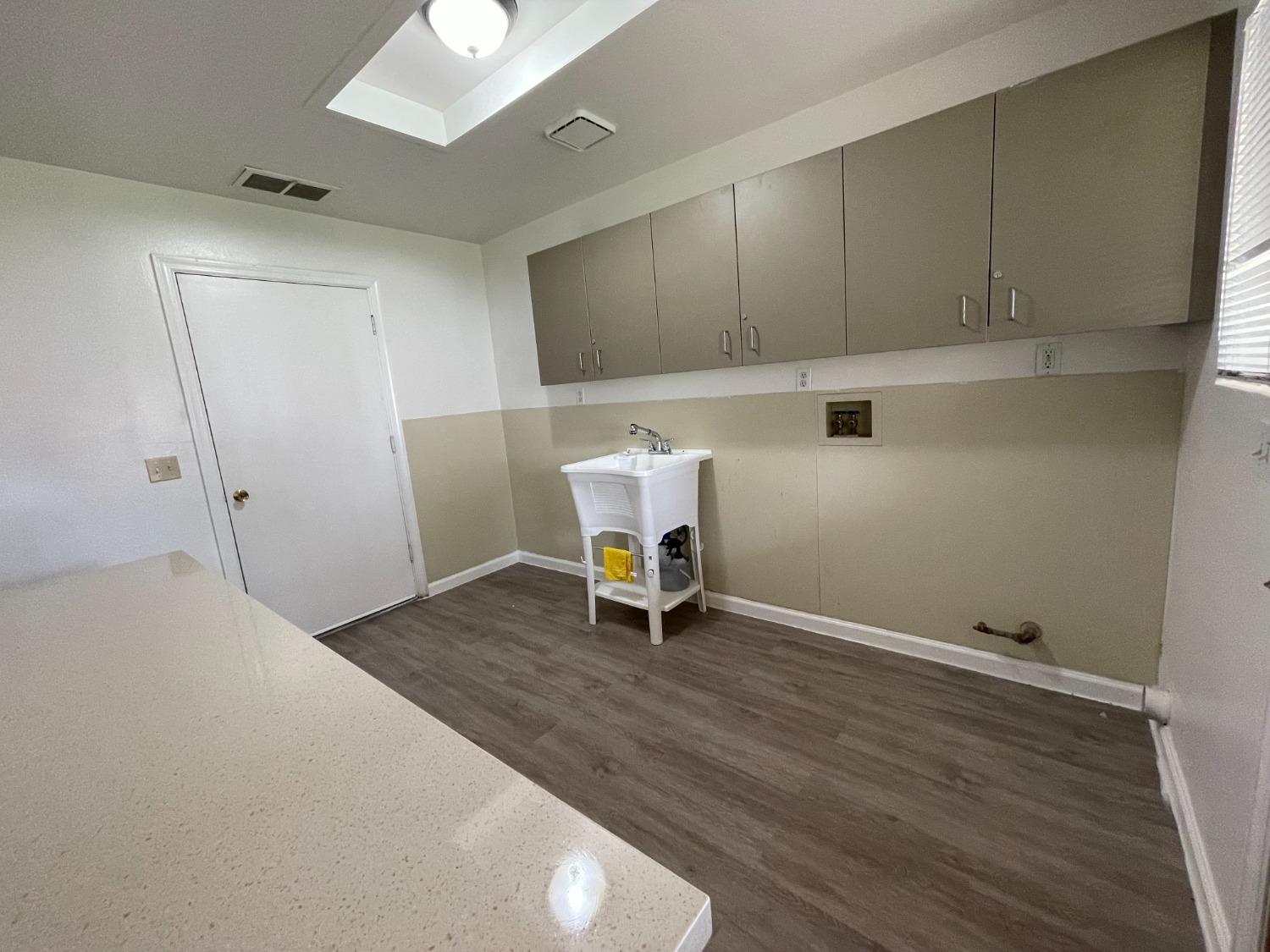 2344 Tivy Valley Road Sanger, CA 93657 - Photo 33 of 61 a room with furniture and wooden floor