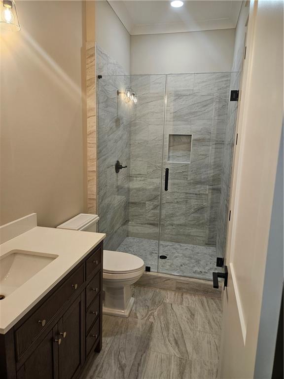 614 Old Tucker Road Stone Mountain, GA 30087 - Photo 12 of 29 a bathroom with a sink a toilet and shower