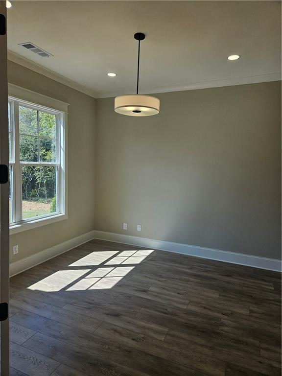 614 Old Tucker Road Stone Mountain, GA 30087 - Photo 18 of 29 a view of an empty room with wooden floor and a window