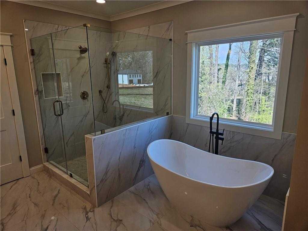 614 Old Tucker Road Stone Mountain, GA 30087 - Photo 20 of 29 a bath room with a toilet a bath tub and a shower