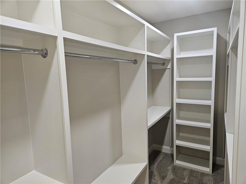 614 Old Tucker Road Stone Mountain, GA 30087 - Photo 24 of 29 a view of walk in closet with empty racks