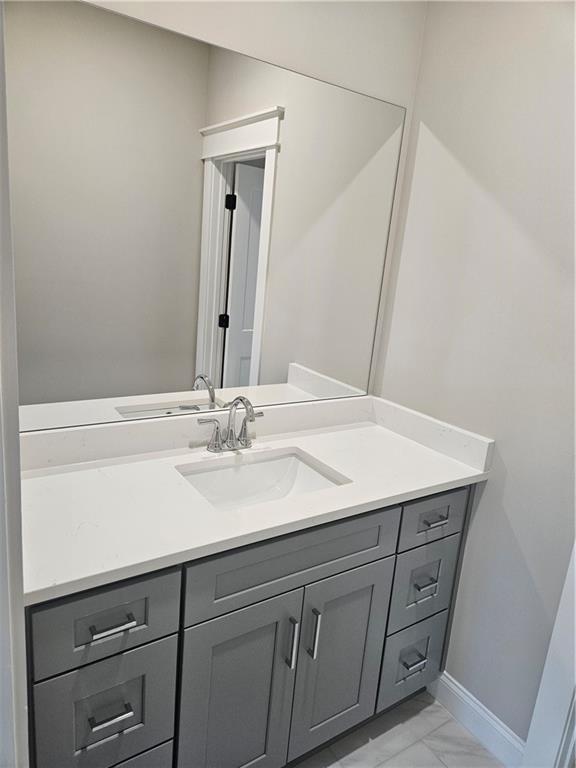 614 Old Tucker Road Stone Mountain, GA 30087 - Photo 28 of 29 a bathroom with a sink and a mirror