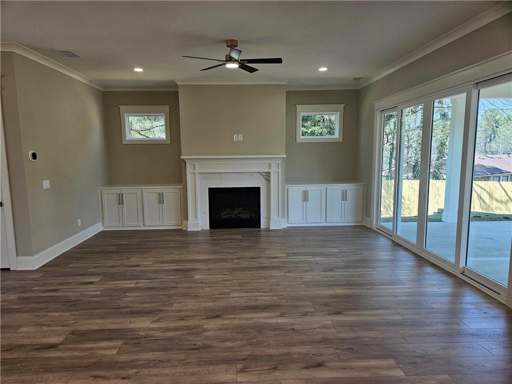 614 Old Tucker Road Stone Mountain, GA 30087 - Photo 5 of 29 a view of an empty room with glass door and a window