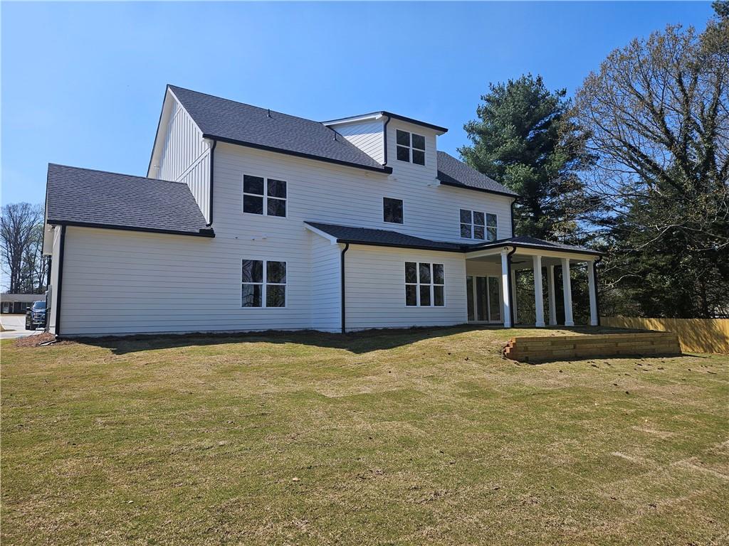 614 Old Tucker Road Stone Mountain, GA 30087 - Photo 8 of 29 a view of an house with backyard and trees