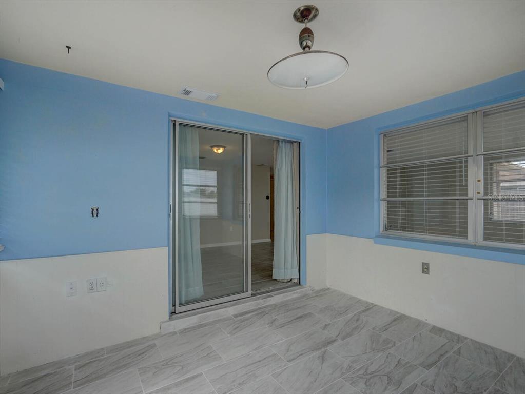 10320 Honeysuckle Lane Port Richey, FL 34668 - Photo 30 of 53 a view of an empty room with a window
