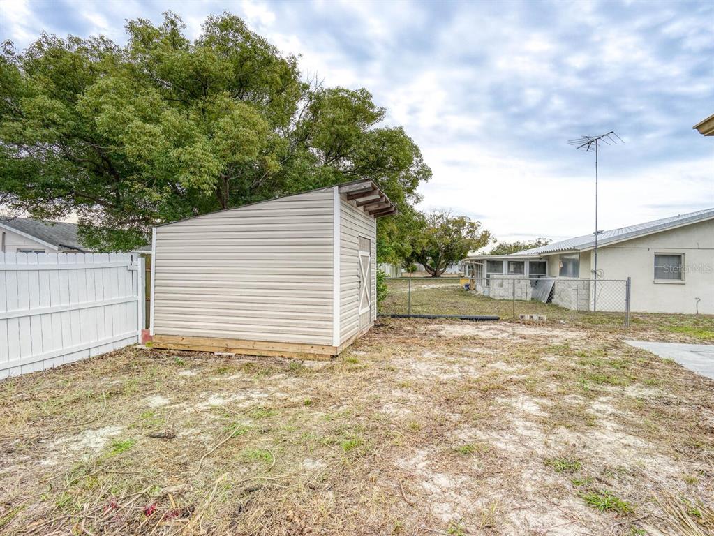 10320 Honeysuckle Lane Port Richey, FL 34668 - Photo 41 of 53 a backyard of a house