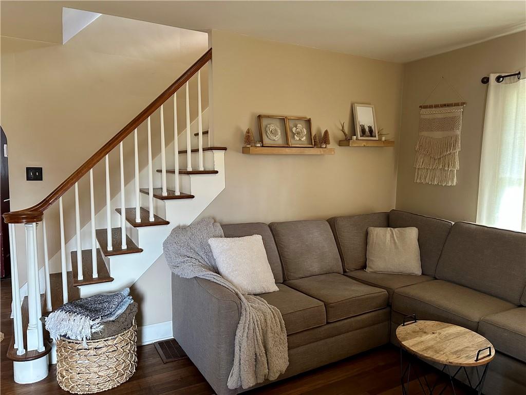 3956 New Castle Road Pulaski, PA 16143 - Photo 15 of 37 a living room with furniture and stairs