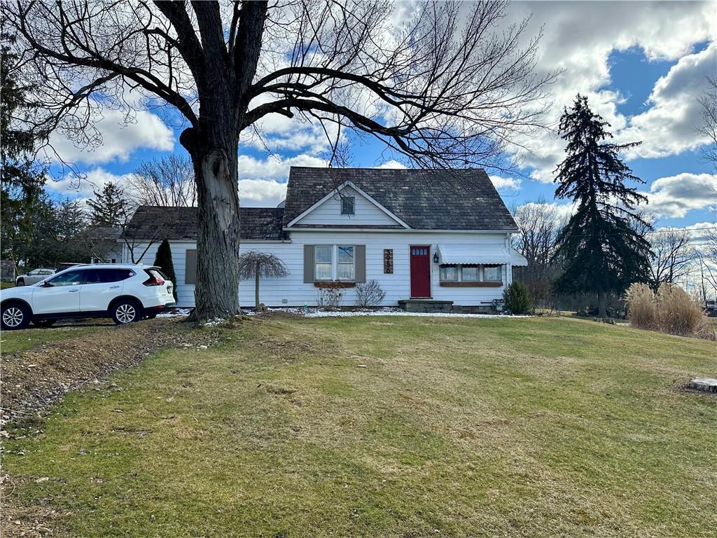 3956 New Castle Road Pulaski, PA 16143 - Photo 27 of 37 a view of a yard in front of a house with a large tree
