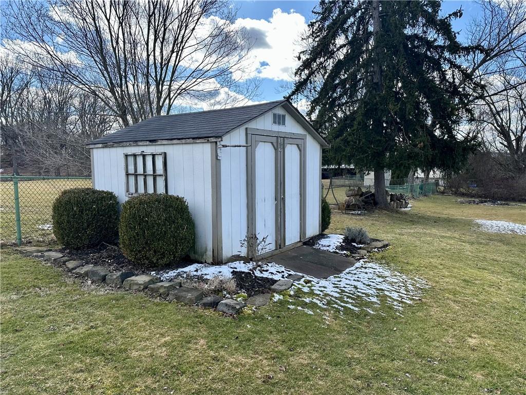 3956 New Castle Road Pulaski, PA 16143 - Photo 32 of 37 a front view of a house with a yard