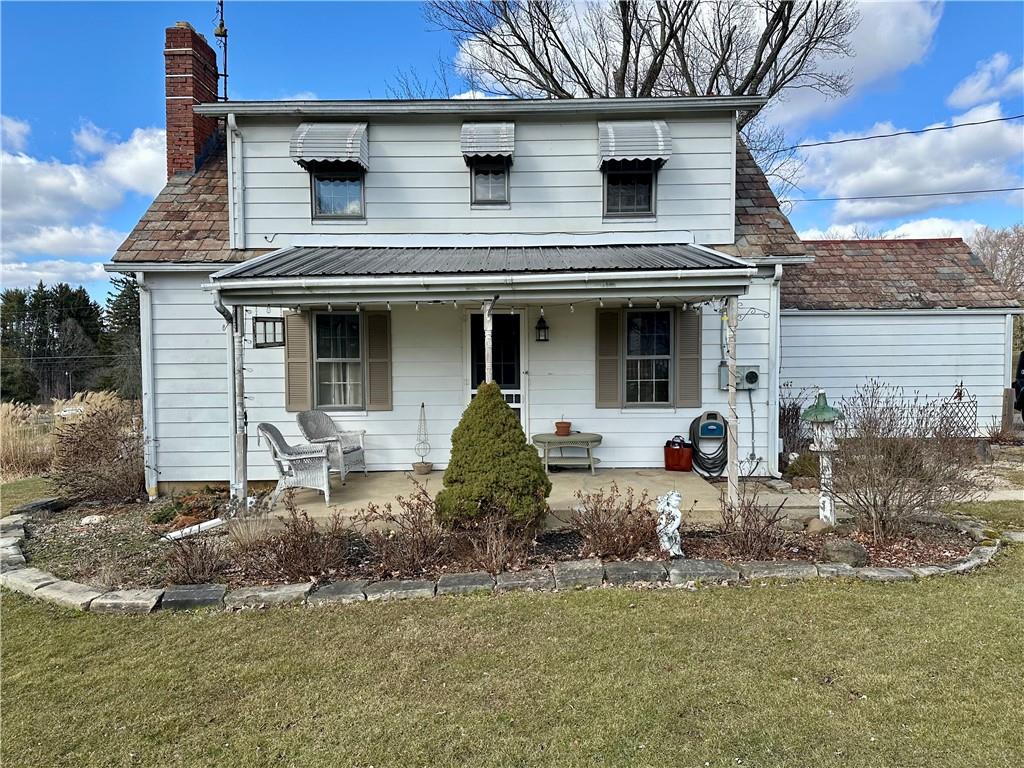 3956 New Castle Road Pulaski, PA 16143 - Photo 33 of 37 a front view of a house with garden