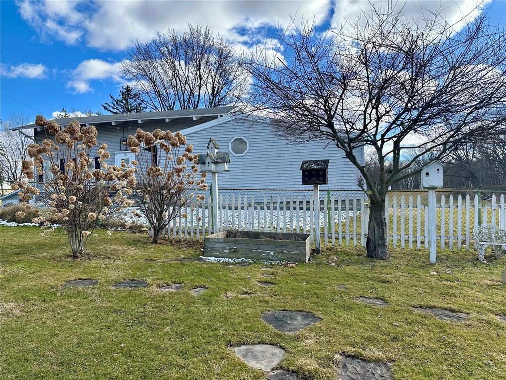 3956 New Castle Road Pulaski, PA 16143 - Photo 34 of 37 a front view of a house with a yard