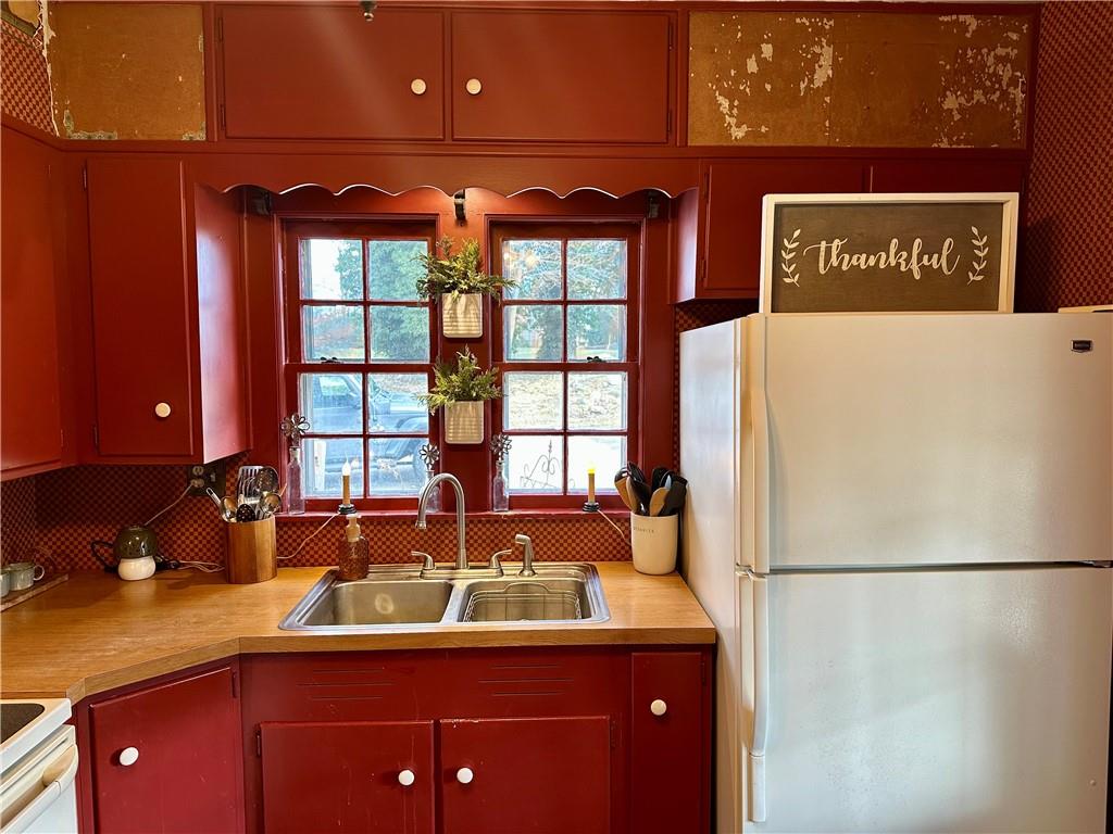 3956 New Castle Road Pulaski, PA 16143 - Photo 4 of 37 a kitchen with stainless steel appliances a sink and a refrigerator