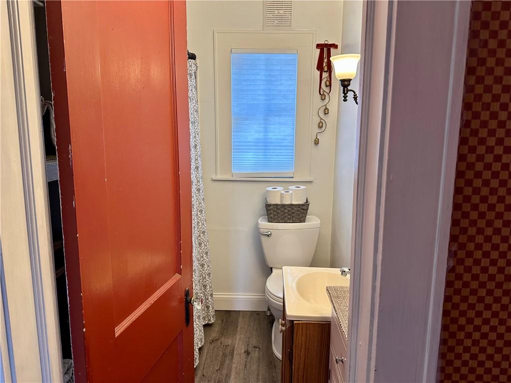 3956 New Castle Road Pulaski, PA 16143 - Photo 5 of 37 a bathroom with a toilet and a shower curtain