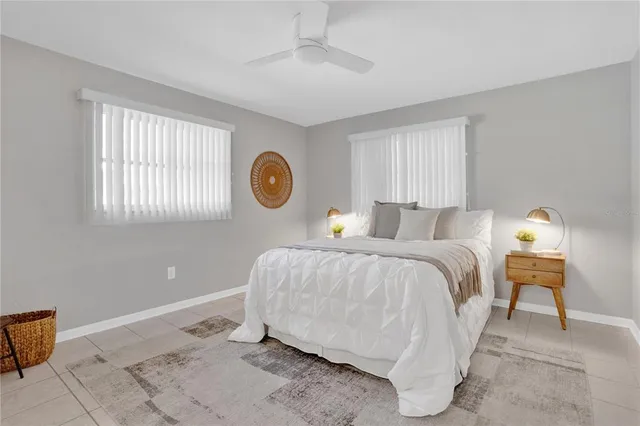 a bedroom with a bed and window