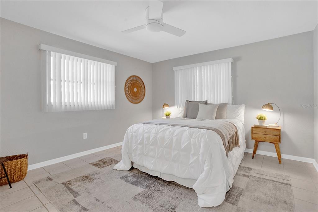 2481 12th Avenue Southwest Largo, FL 33770 - Photo 11 of 21 a bedroom with a bed and window