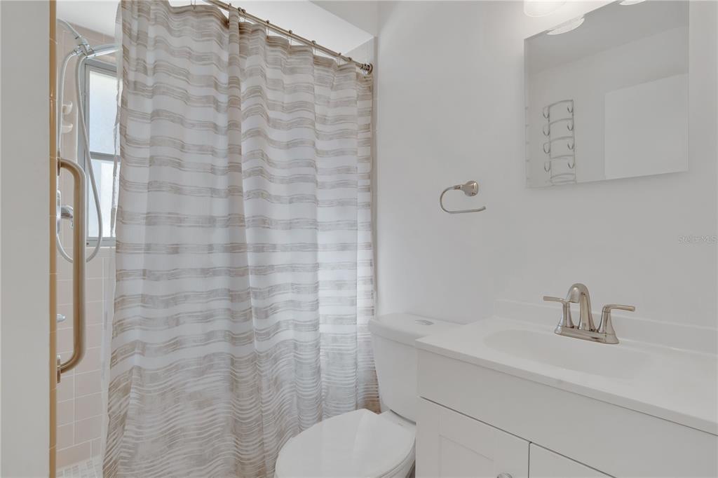 2481 12th Avenue Southwest Largo, FL 33770 - Photo 15 of 21 a bathroom with a toilet sink and shower