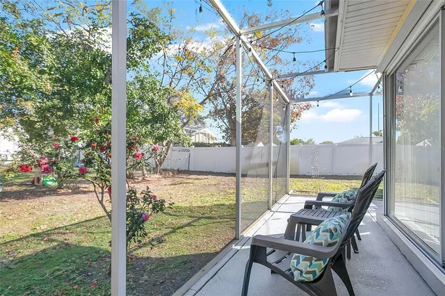 a view of an chairs and table in the patio