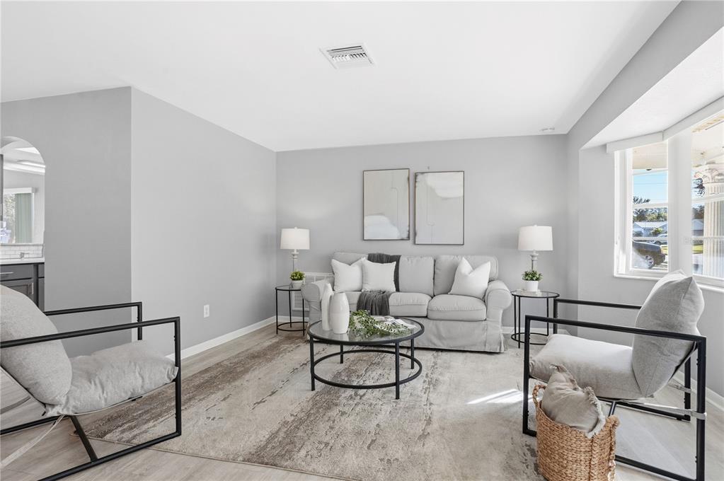 2481 12th Avenue Southwest Largo, FL 33770 - Photo 3 of 21 a living room with furniture and a potted plant
