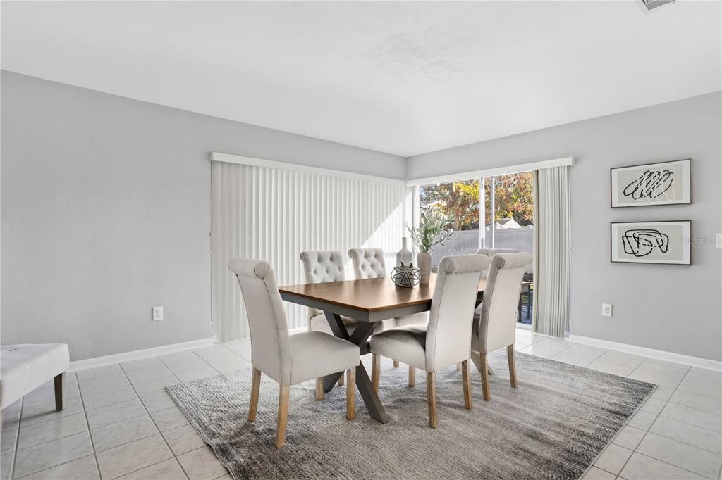2481 12th Avenue Southwest Largo, FL 33770 - Photo 8 of 21 a view of a dining room with furniture and wooden floor