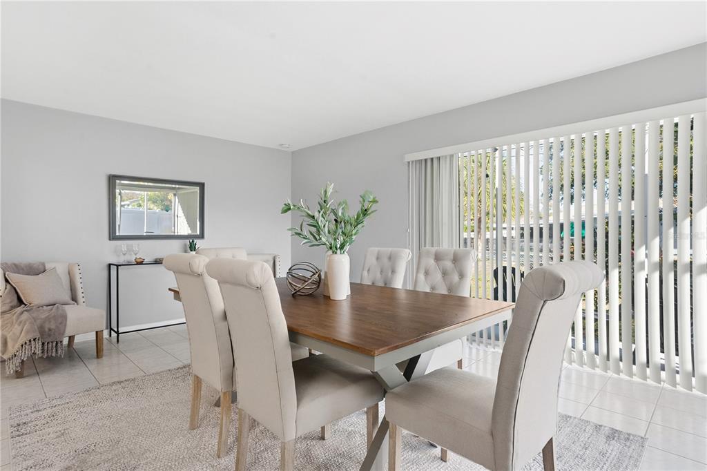 2481 12th Avenue Southwest Largo, FL 33770 - Photo 9 of 21 a view of a dining room with furniture and a potted plant