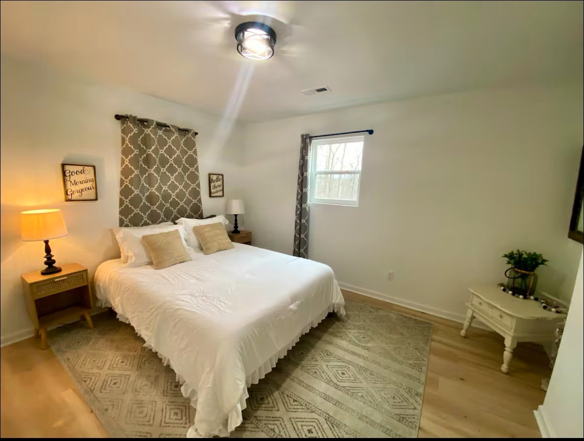 1975 Kelly Road Holladay, TN 38341 - Photo 70 of 95 a bedroom with a bed and a table
