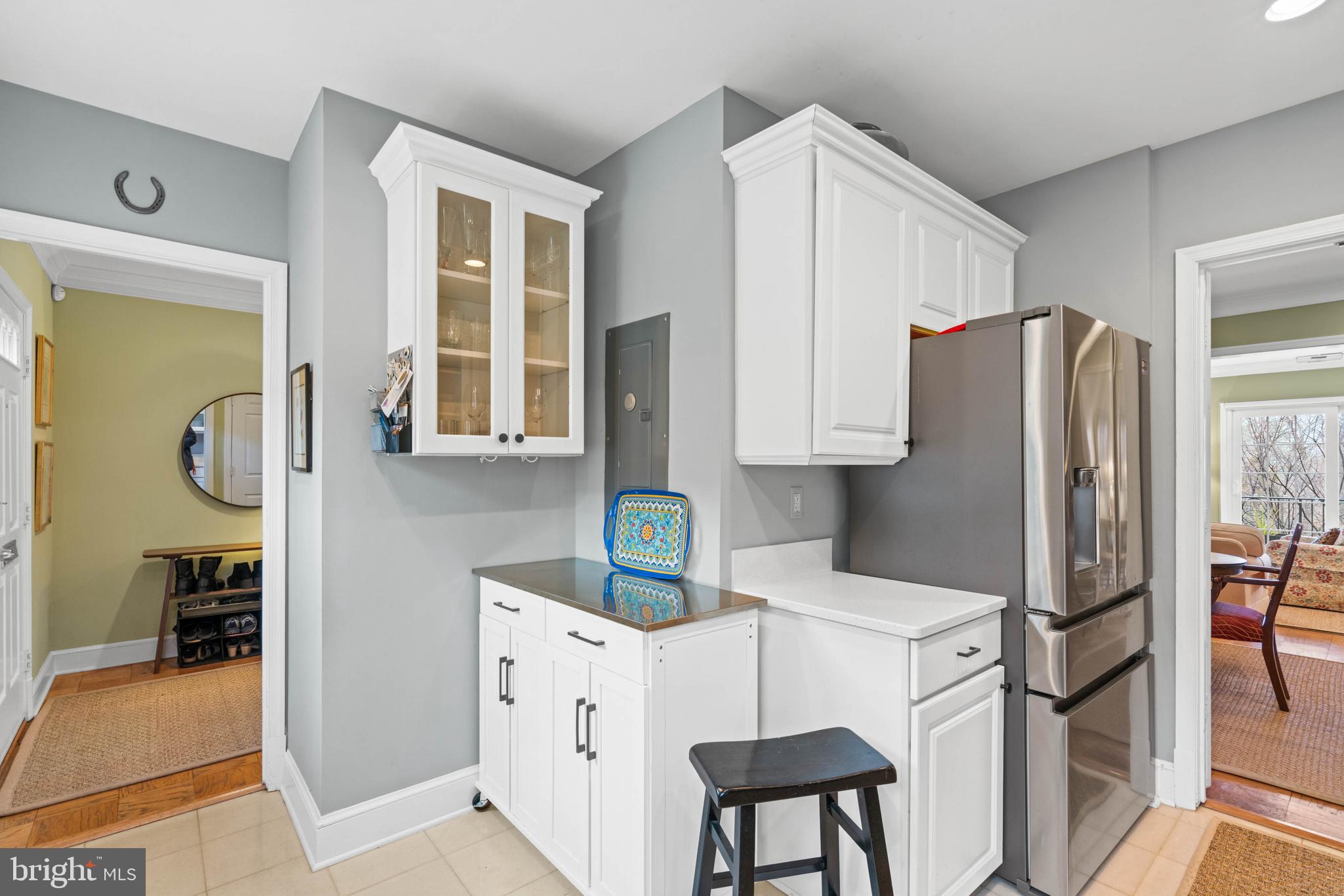 3297 Sutton Place Northwest, Unit B Washington, DC 20016 - Photo 11 of 43 a kitchen with stainless steel appliances granite countertop a refrigerator and a stove top oven