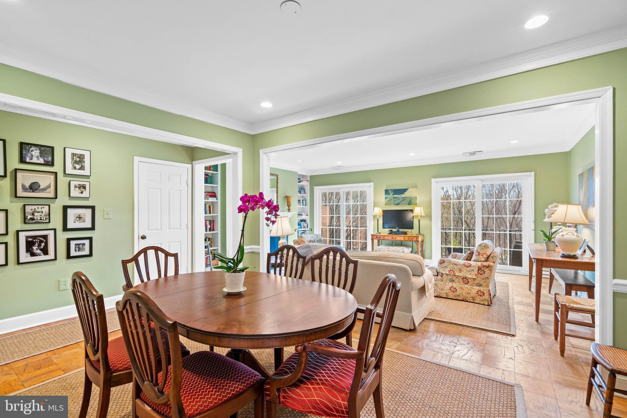 3297 Sutton Place Northwest, Unit B Washington, DC 20016 - Photo 17 of 43 a view of a dining room with furniture and a potted plant