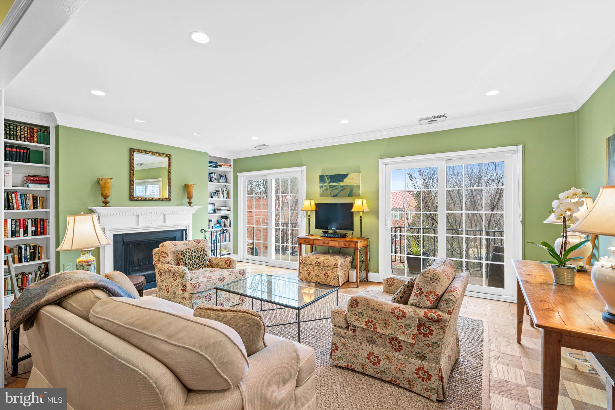 3297 Sutton Place Northwest, Unit B Washington, DC 20016 - Photo 21 of 43 a living room with furniture a fireplace and a large window