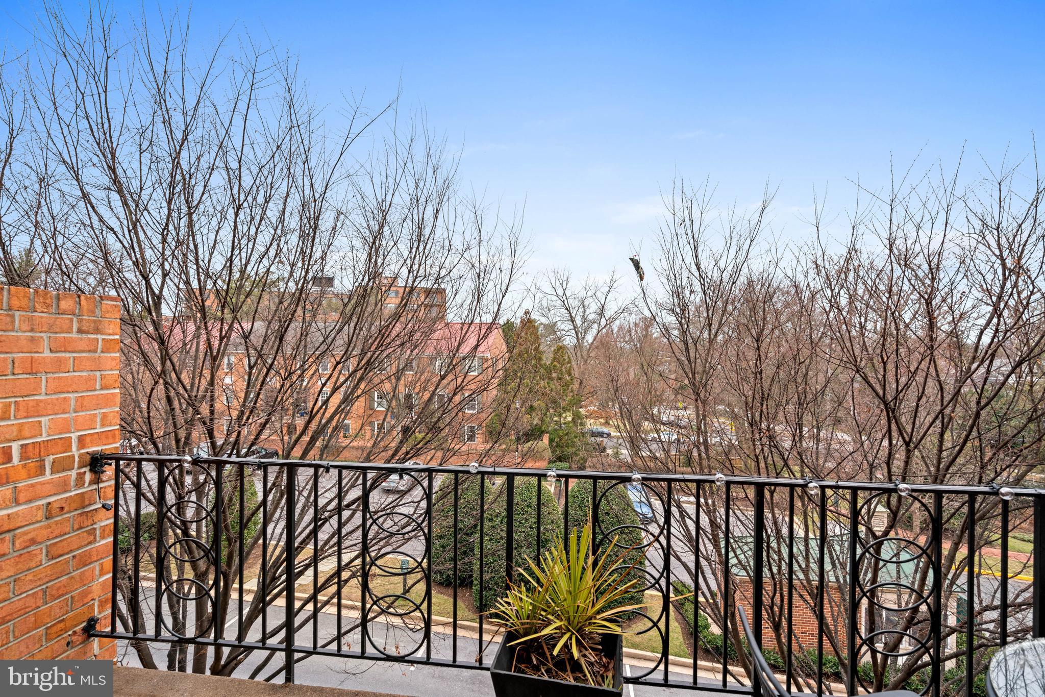 3297 Sutton Place Northwest, Unit B Washington, DC 20016 - Photo 27 of 43 a view of a balcony with a forest