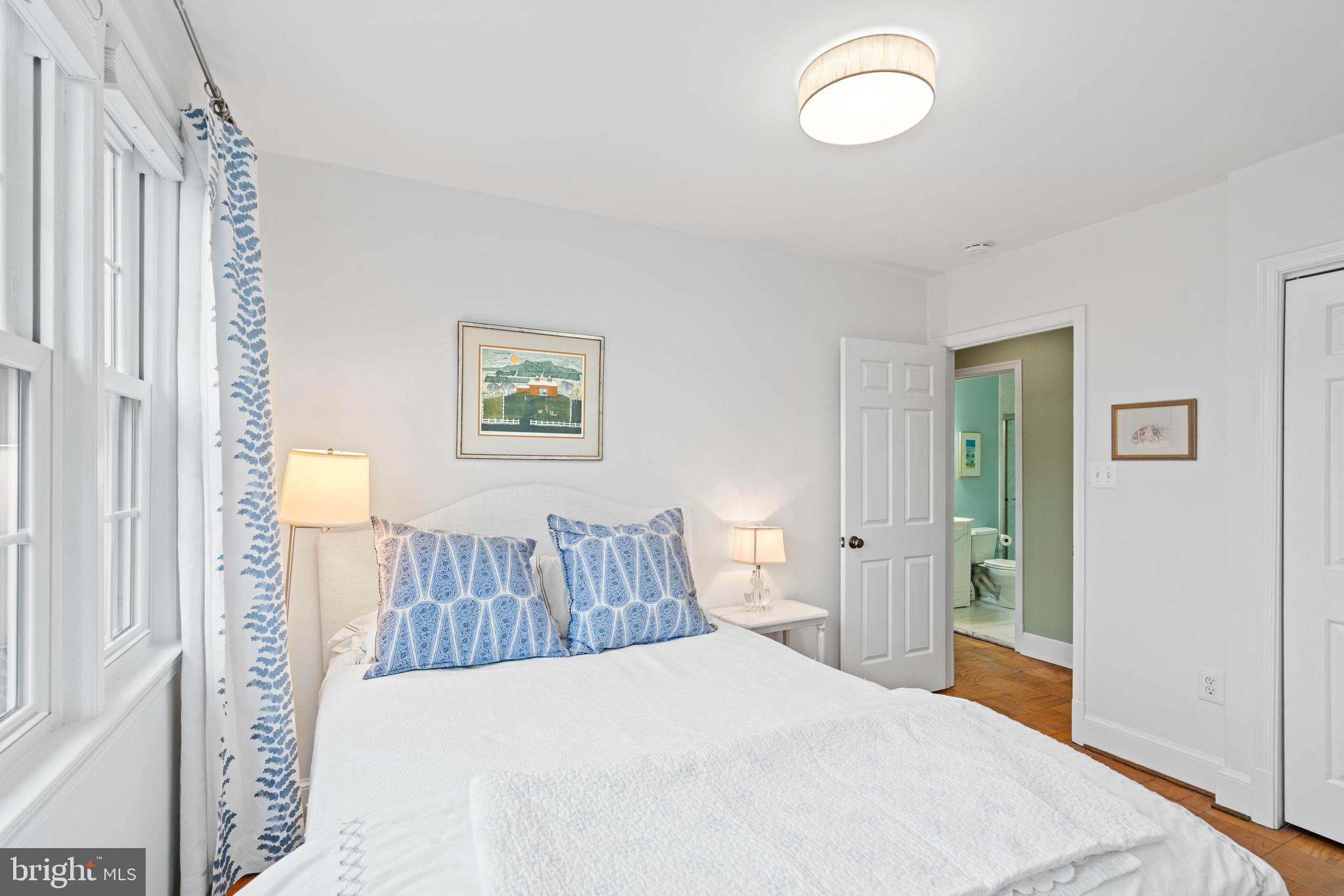 3297 Sutton Place Northwest, Unit B Washington, DC 20016 - Photo 30 of 43 a bedroom with a bed and a window