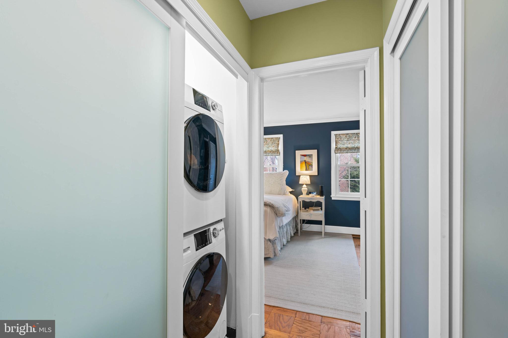 3297 Sutton Place Northwest, Unit B Washington, DC 20016 - Photo 35 of 43 a view of a hallway with washer and dryer