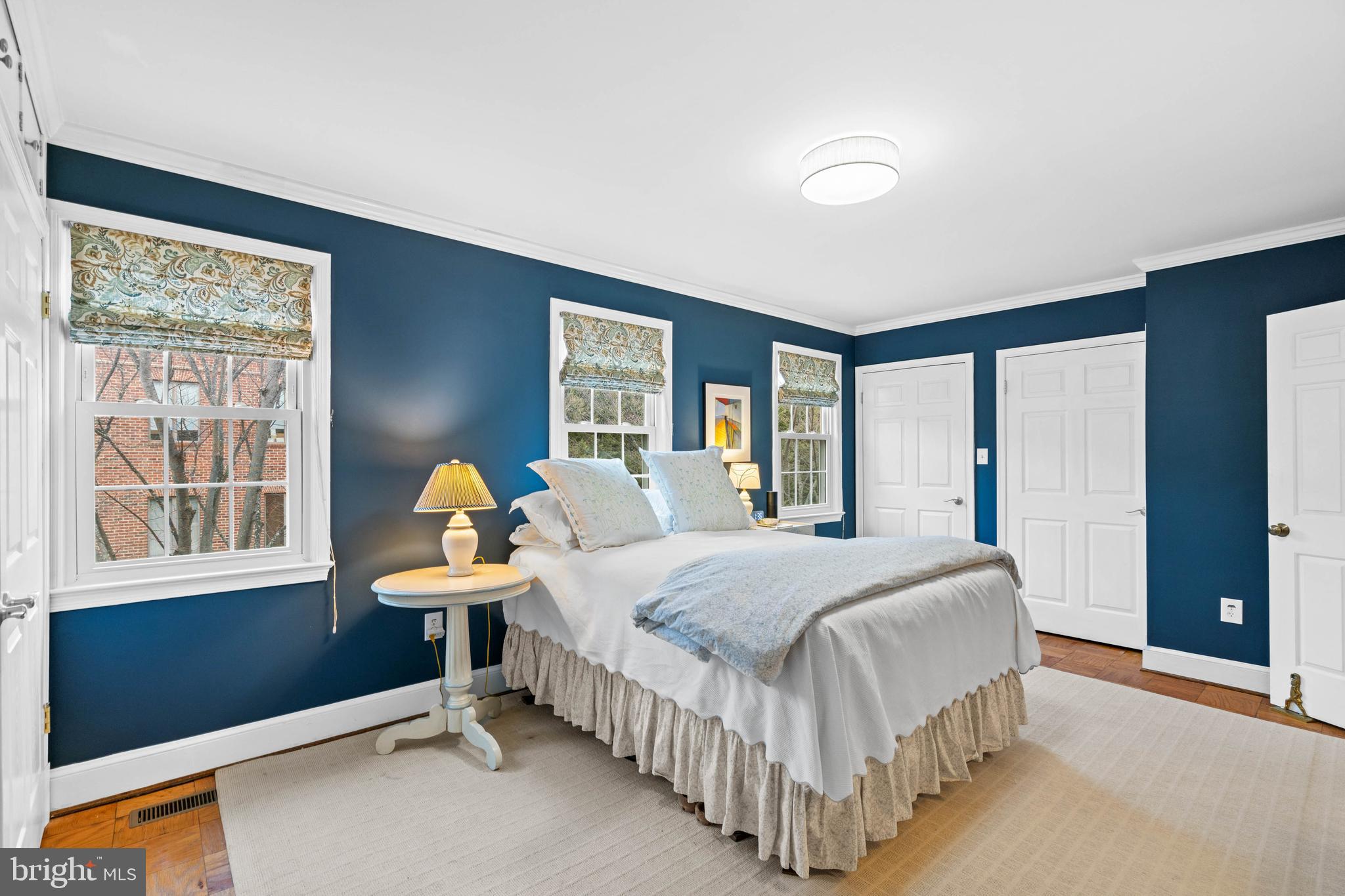 3297 Sutton Place Northwest, Unit B Washington, DC 20016 - Photo 40 of 43 a bedroom with a bed and window