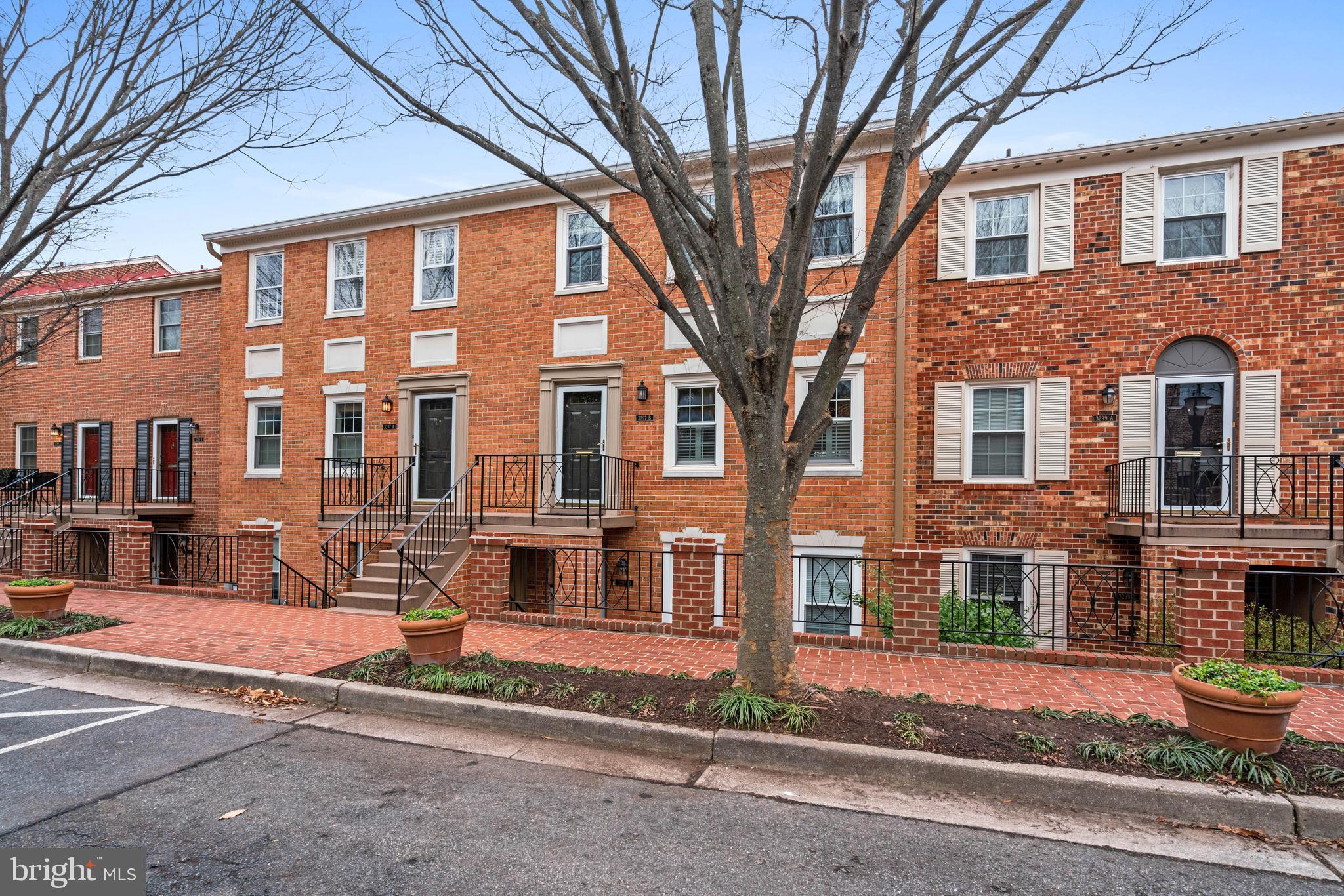 3297 Sutton Place Northwest, Unit B Washington, DC 20016 - Photo 4 of 43 front view of a building with a street